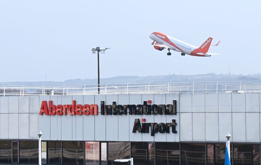A plane taking off from aberdeen airport