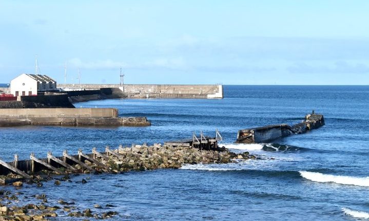 Lossiemouth breakwater viewed from beach. 