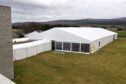 PLEASE ADD CR NUMBER.
The marquee for next weeks Scottish golf conference, part of which is being held at Culloden takes shape beside the visitor centre.
14th March '24
Sandy McCook/DC Thomson