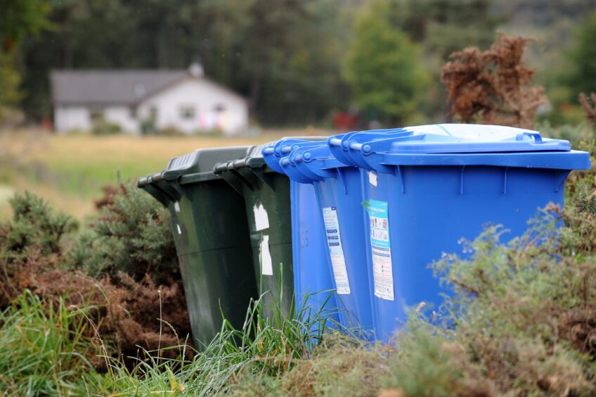 Blue and green bins in the Highlands.