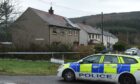 Police at the scene of the house near Buckie. Image: Sandy McCook/DC Thomson.