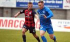 Peterhead midfielder Conor O'Keefe, right, battles with Matthew Grant of Stranraer in a League Two fixture at Balmoor.