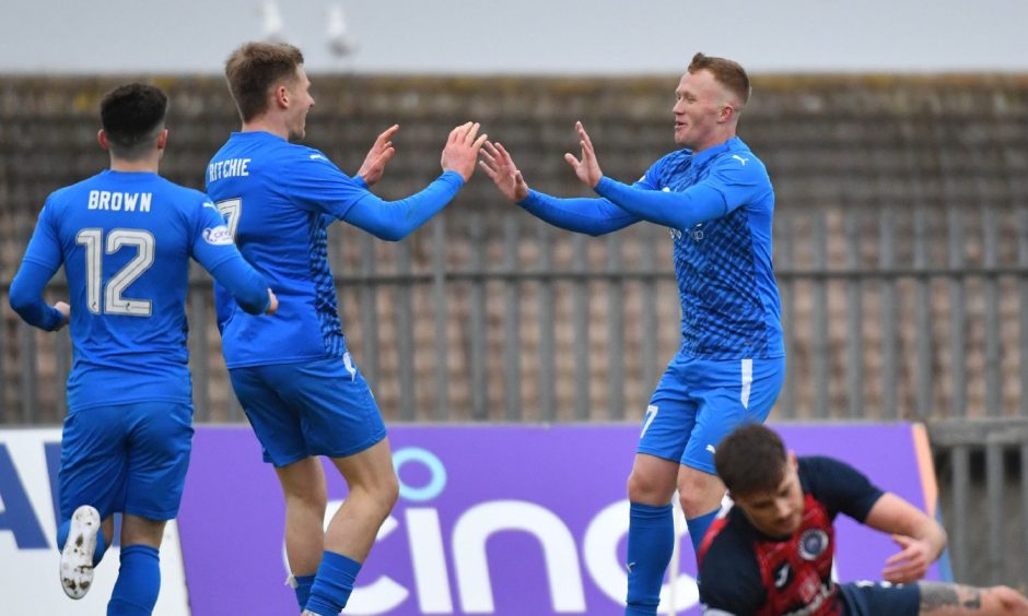 Conor O'Keefe, right, celebrates after scoring for Peterhead against Stranraer in a League Two fixture at Balmoor.