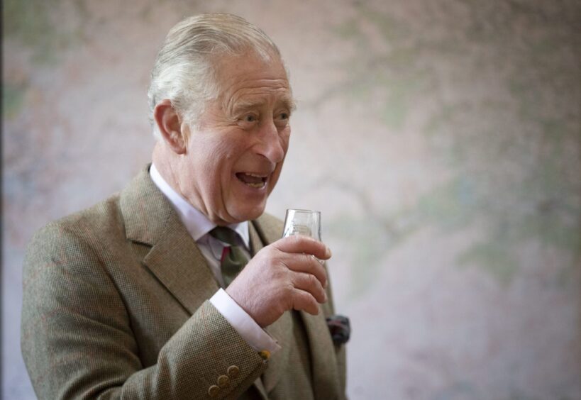 King Charles, then the Duke of Rothesay, enjoys a wee dram at Royal Lochnagar in 2018. 
