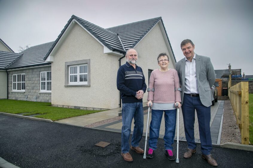 Alan and Jacqueline Scott outside their new home at Rothney West in Insch with Allan Brown, the managing director at Drumrossie Homes.