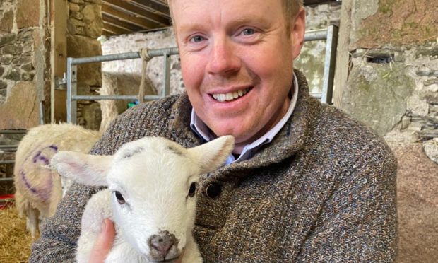 MSP Tim Eagle joined a Holyrood debate from his lambing shed.