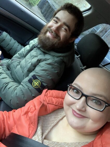 Kirsty with no hair in the car with boyfriend Liam Duncan.