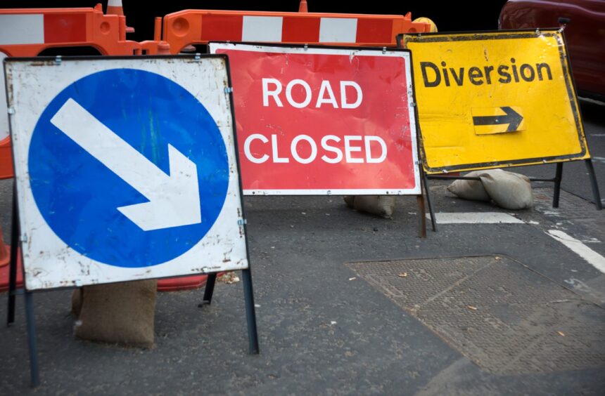 Road closed and diversion signs. 