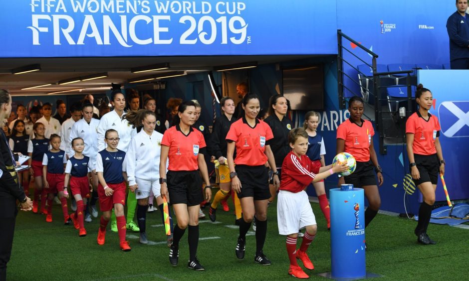 Scotland captain Rachel Corsie leads Scotland out at the Parc des Princes for the World Cup match against Argentina in 2019.