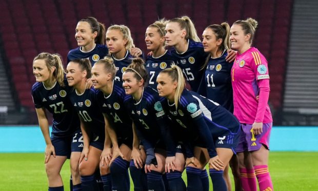 Scotland, led by captain Rachel Corsie, in a team photo before a match at Hampden.