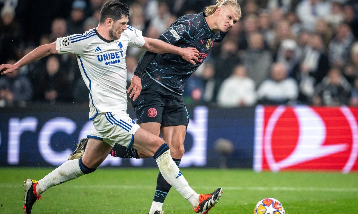 FC Copenhagen's Scott McKenna outmuscles Manchester City striker Erling Haaland to win possession in a UEFA Champions League round of 16 first leg. 