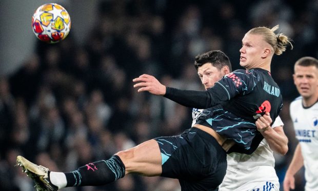 FC Copenhagen's Scott McKenna in action against Manchester City's Erling Haaland during the UEFA Champions League round of 16 first leg. Image: Shutterstock.