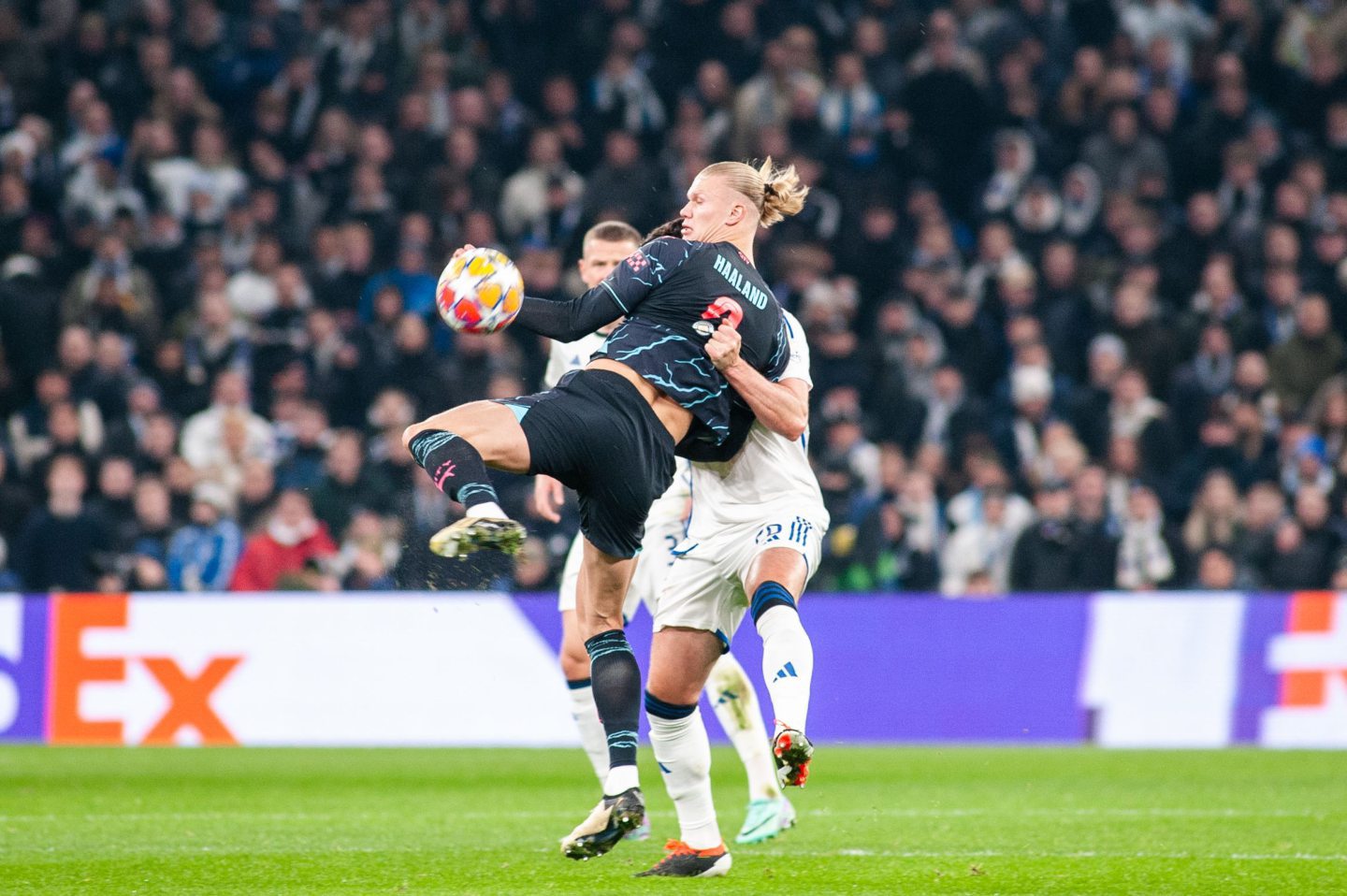 Erling Haaland of Manchester City battling for possession with Scott McKenna of FC Copenhagen during the UEFA Champions League round of 16 first leg. Image: Shutterstock 