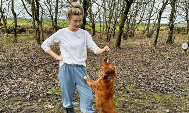 Georgia 'toff' Toffolo enjoys playing with her dog Monty in the Aberdeenshire sping time.