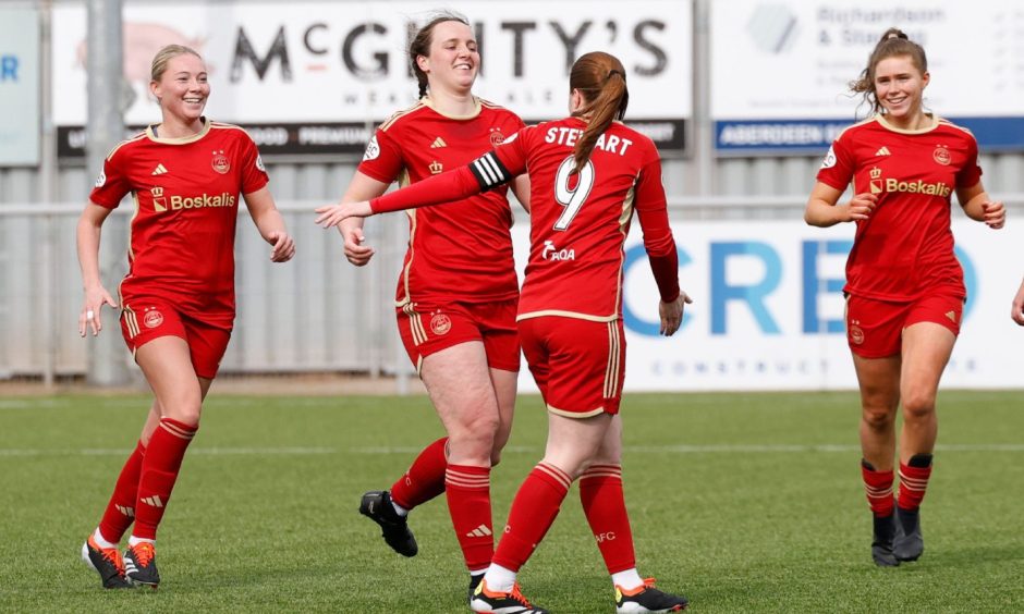 Aberdeen Women celebrate Bayley Hutchison's winner in the SWPL match against Hamilton Accies.