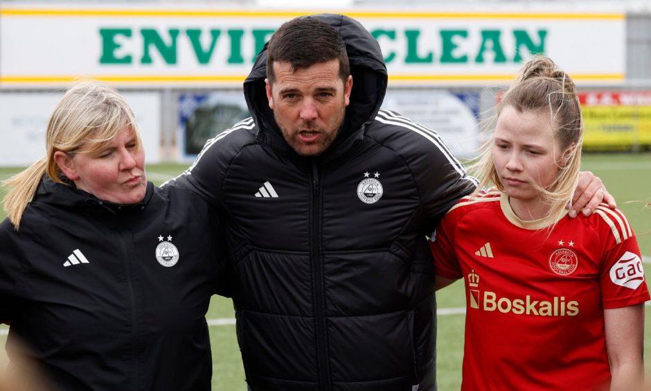 Aberdeen Women manager Clint Lancaster, centre, and coach Claire Garrett, left.