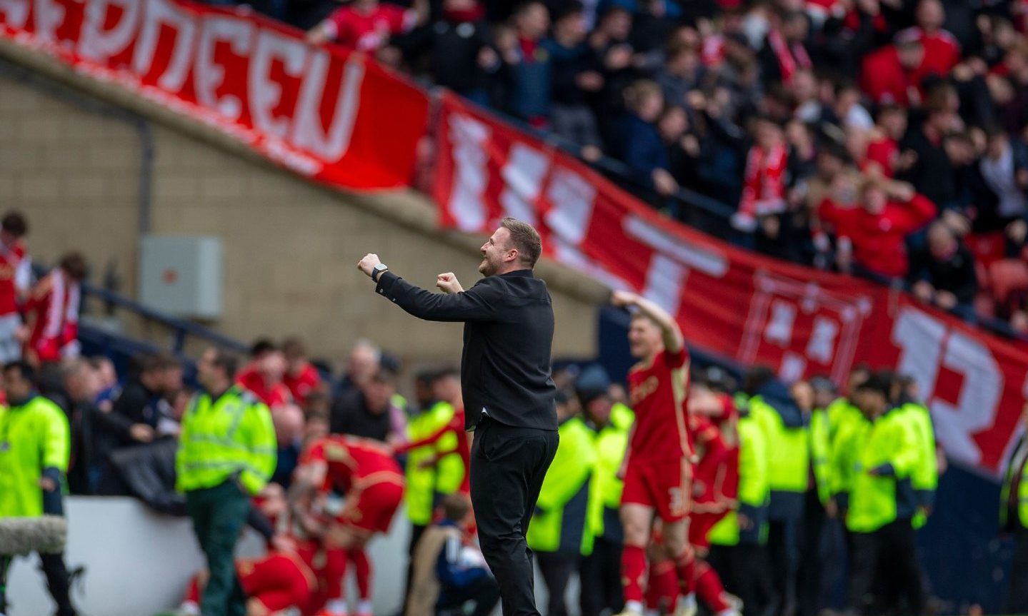 Aberdeen interim boss Peter Leven celebrates after Angus MacDonald of Aberdeen scored to make it 3-3 in the 119th minute; against Celtic.