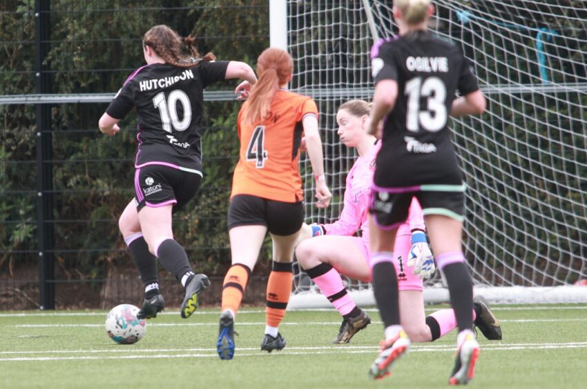 Bayley Hutchison rounds the Dundee United goalkeeper to score her hat-trick and Aberdeen Women's fifth in the SWPL win.