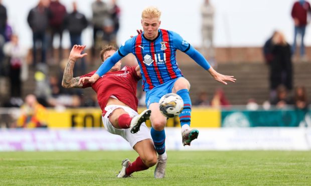 Luis Longstaff (facing) in action for Caley Thistle against Arbroath.