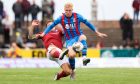 Luis Longstaff (facing) in action for Caley Thistle against Arbroath.