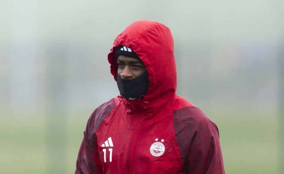 Aberdeen striker Duk braving the cold snap in April during a training session at Cormack Park ahead of the trip to Livingston. Image: SNS