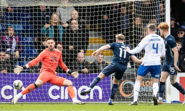 Ross County's Josh Sims scores his team's third goal in the 3-2 win over Rangers on Sunday.