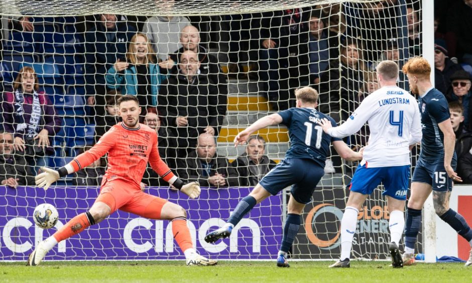 Ross County's Josh Sims scores his team's third goal in the 3-2 win over Rangers on April 14, 2024 at the Global Energy Stadium, Dingwall. 