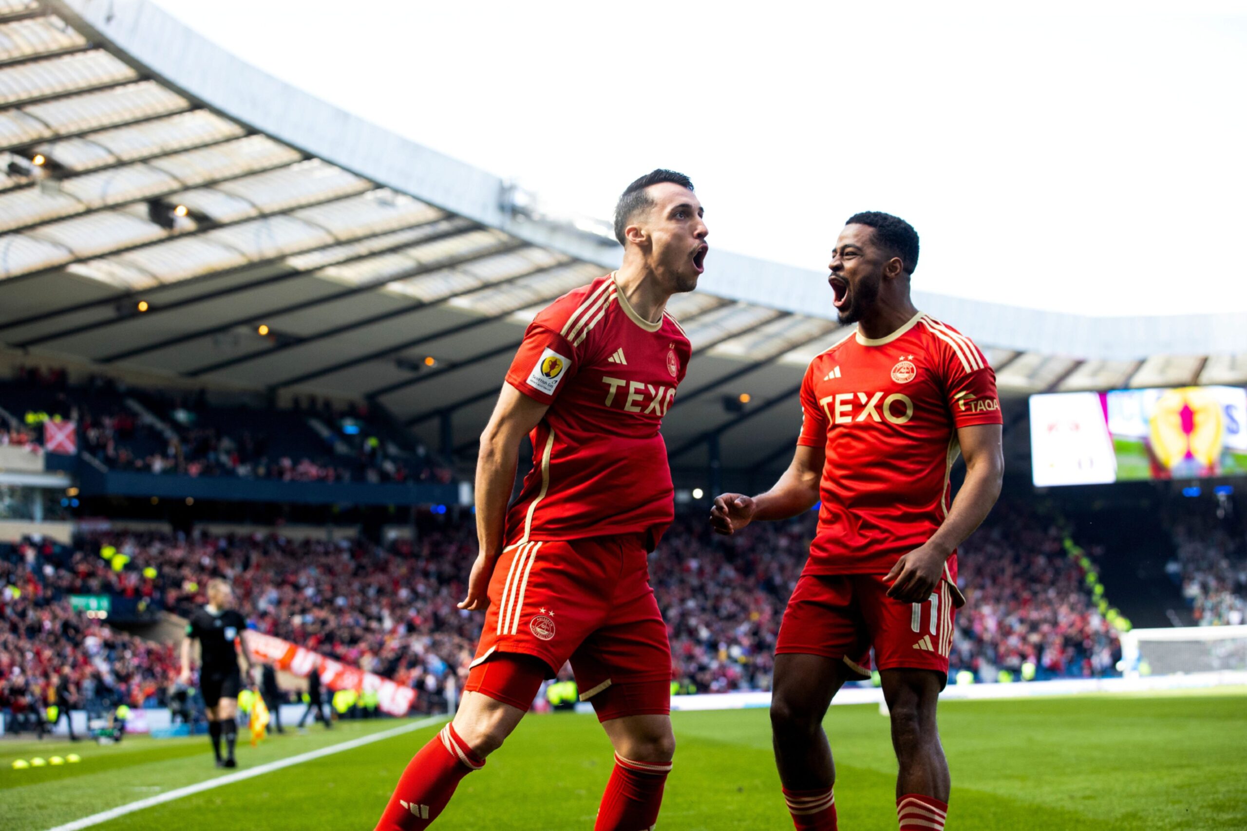 Aberdeen striker Bojan Miovksi celebrates with Duk after scoring to make it 1-0 in the Scottish Cup semi-finaL Image; SNS 