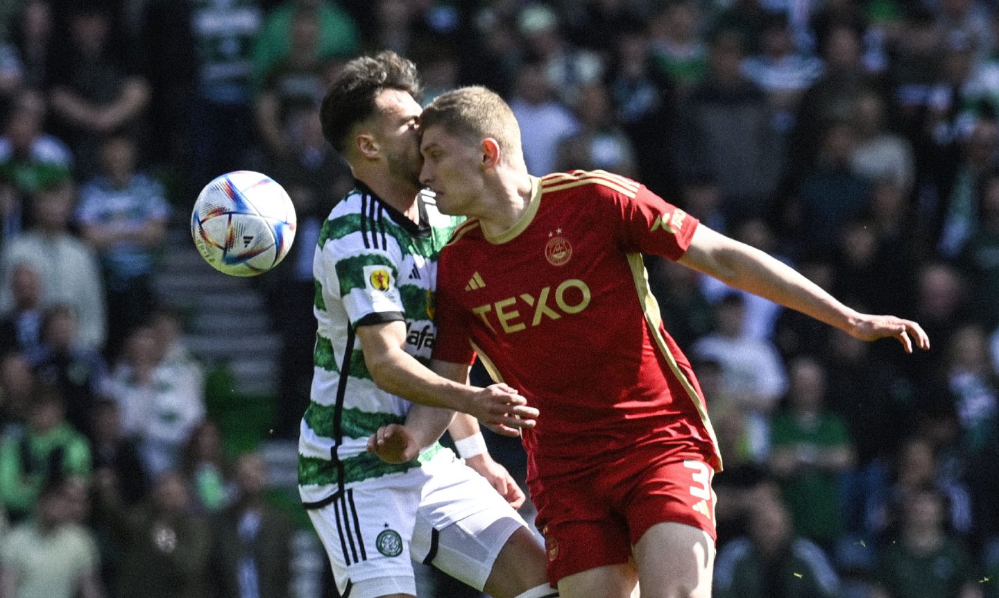 Celtic's Nicolas Kuhn (L) and Aberdeen's Jack MacKenzie collide during the Scottish Cup semi-final at Hampden. Image: SNS 