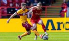 Motherwell's Jack Vale and Aberdeen's Jack MacKenzie in action. Image: SNS