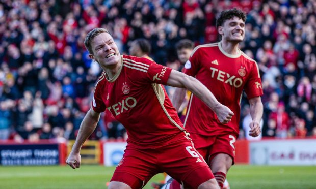 Aberdeen's Stefan Gartenmann celebrates as he scores to make it 1-0 against Mothewell at Pittodrie. Image; SNS