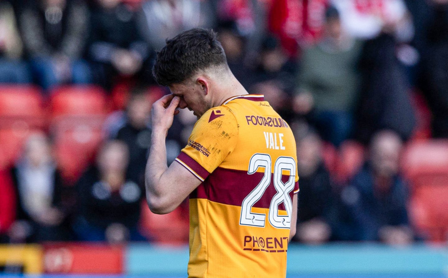 Motherwell's Jack Vale looks dejected after he is shown a red card against Aberdeen. Image: SNS