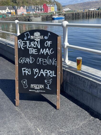 A sign outside the MacDonald Hotel signalling the reopening. 