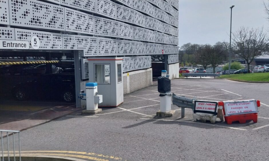 Signs outside the ARI's Lady Helen multi-storey car park explain that staff can use the upper levels for parking