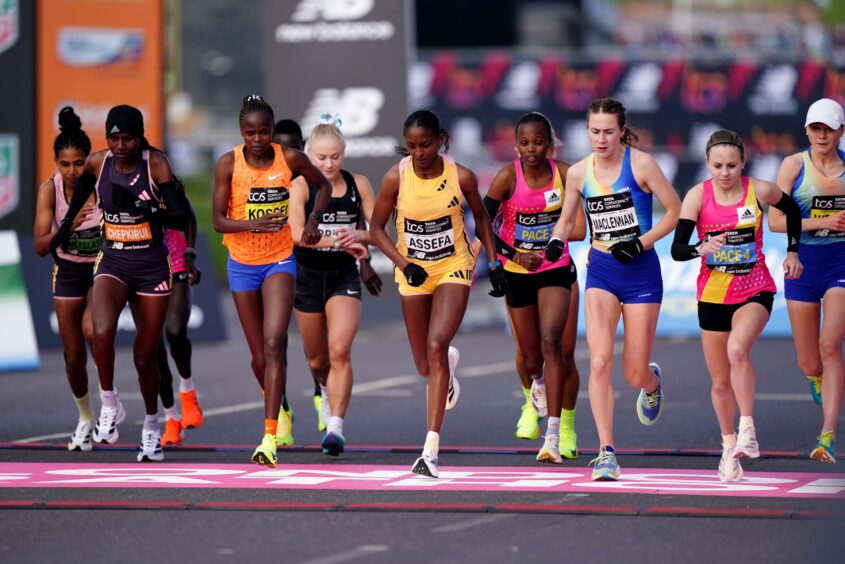 Runners including Joyce Chepkirui, Brigid Kosgei, Becky Briggs, Tigst Assefa and Mhairi Maclennan as the women's elite race gets under way during the TCS London Marathon. Image: PA.