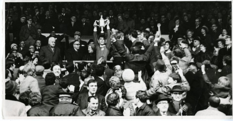 Martin Buchan, Aberdeen FC captain, holds aloft the Scottish Cup having beaten Celtic FC 3-1 at Hampden Park, Glasgow. April 11 1970.