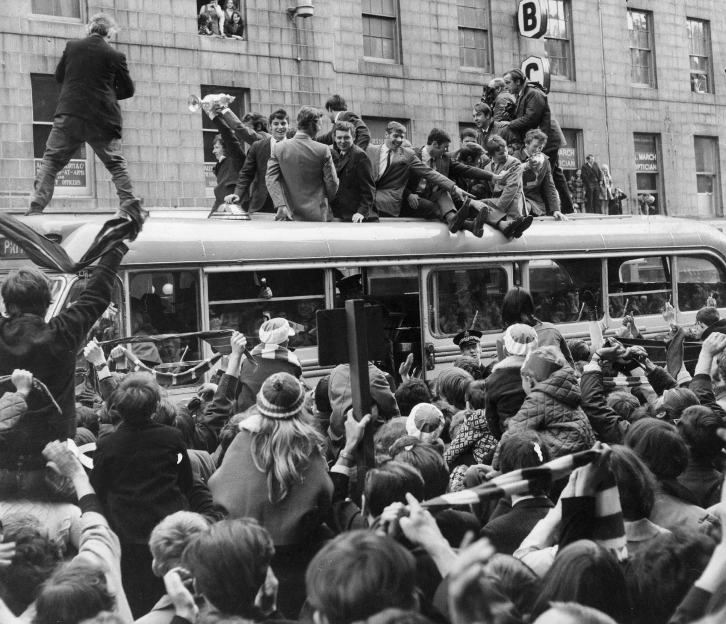 Jubilant Aberdeen players pick out friends in the crowd as Joe Harper holds the Scottish cup high in 1970.