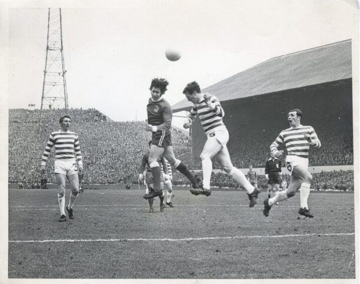 Aberdeen's McKay beats Celtic's McNeil to the ball in a heading duel in the 1st half of the final, but the ball goes past the post.