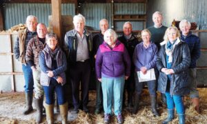Andrew Rafferty, back row, fourth from right, with family, local vets and farmers. Picture by James Alastair Kendall.