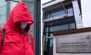 Anne Mulloy covered up as she arrived for her fraud trial at Peterhead Sheriff Court.