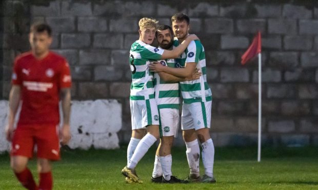 Josh Peters, right, celebrates scoring for Buckie Thistle against Brora Rangers with team-mates Jack MacIver, left, and Andrew MacAskill. Pictures by Jasperimage.