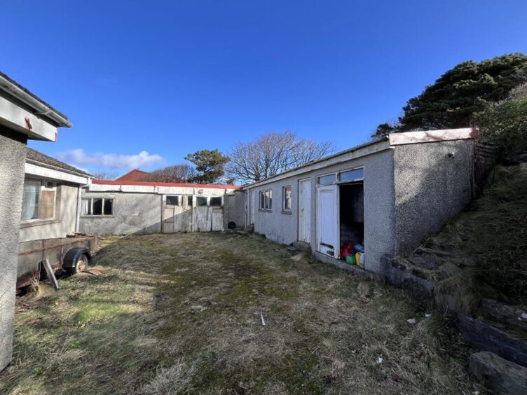 The outbuildings included in the Shetland fixer-upper for sale