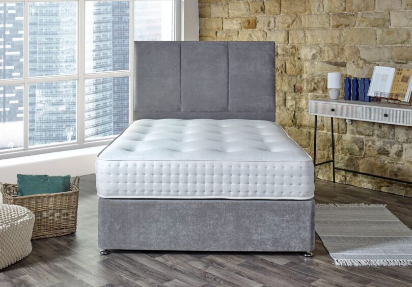 Grey bed with Just Add Sleep mattress