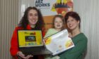 ABZWorks Aberdeen's Angela Taylor with successful candidate Kasia Rozmarynowska and her daughter Amelia