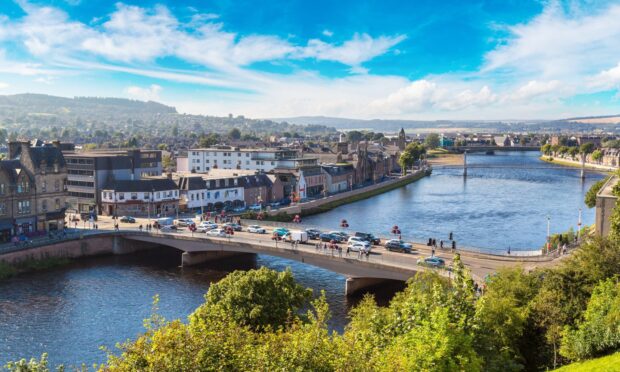 bird's eye view of the city of Inverness, including a bridge over the local river