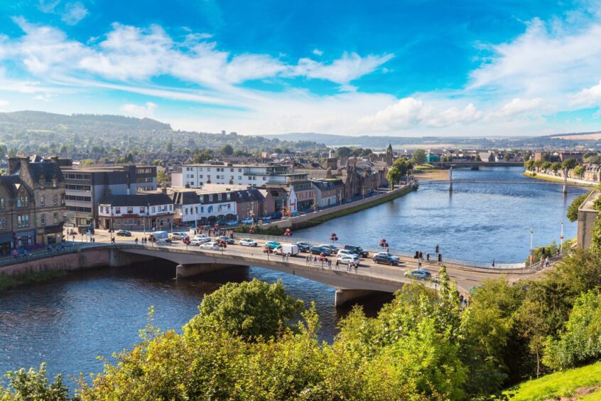 bird's eye view of the city of Inverness, including a bridge over the local river