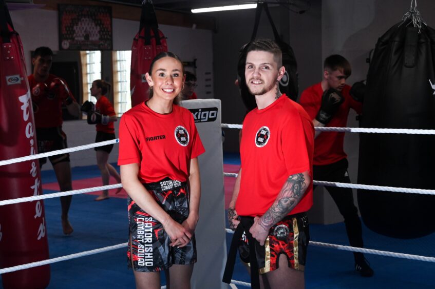 Kickboxer Eilidh Craib and her coach Shane Weir stand side by side.