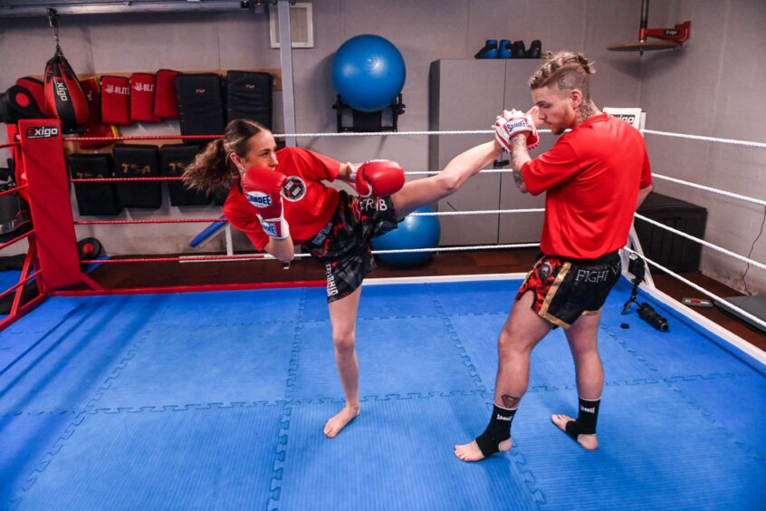 Eilidh Craib in a kickboxing training session with coach Shane Weir.