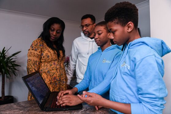 The Olusoji family attended a coding class together, and now children Dara and Fola are members of the NextGen coding club in Aberdeen. Darrell Benns/DC Thomson