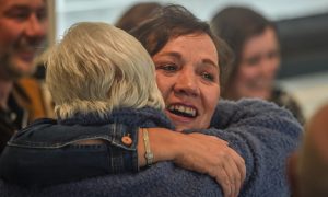 Suzanne Davies hands out the hugs in Chapelton on Sunday. The 46-year-old celebrated 10 years since her brain cancer diagnosis. Image: Darrell Benns/DC Thomson